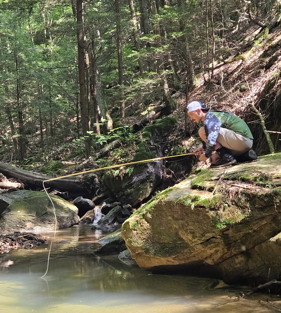 Jesse Fleeger fishing a small, technical backcountry creek — the kind of skinny, technical water his flies get tested on