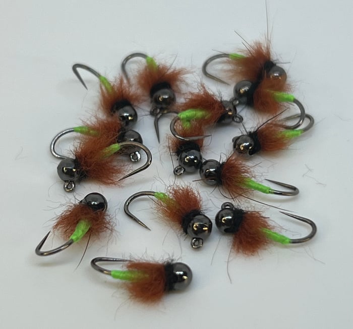 Fleeger's euro nymphs — dark-beaded jig flies with a small block of bright chartreuse set right at the back end