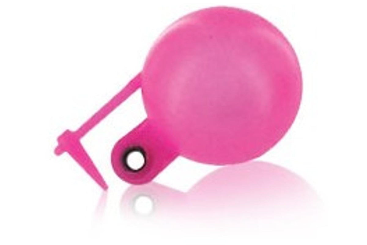 A pink Thingamabobber round-bubble strike indicator, its post-and-grommet peg clearly visible — the loop-the-leader-through-and-peg attachment that can put a permanent kink in your tippet (photo: Trident Fly Fishing)