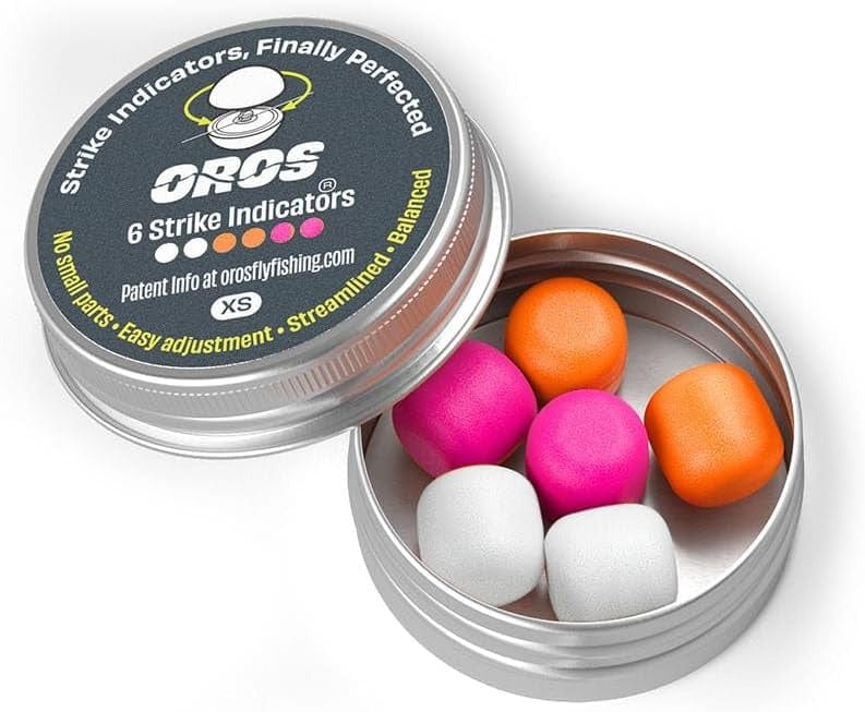 A tin of OROS screw-on strike indicators — six XS Soft-Lock foam balls in orange, pink, and white, lid reading '6 Strike Indicators' (product photo: OROS)